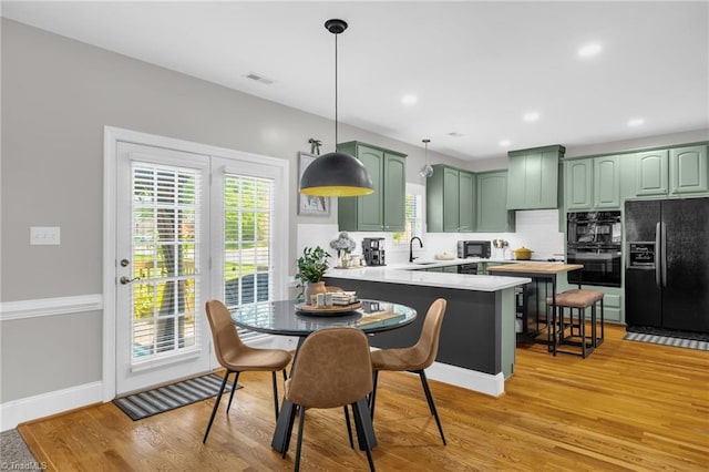 217 Oakmont Park Ct, Kernersville, NC 27284 - dining area featuring light wood-style floors and recessed lighting