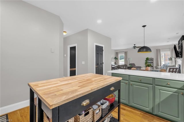 217 Oakmont Park Ct, Kernersville, NC 27284 - kitchen with light wood finished floors, a center island, open floor plan, and green cabinets