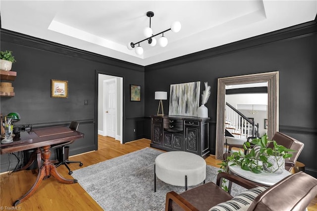 217 Oakmont Park Ct, Kernersville, NC 27284 - living room featuring a raised ceiling, wood finished floors, and stairway