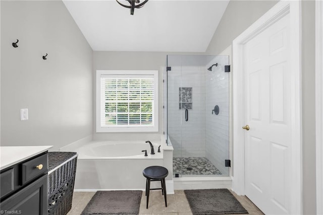 217 Oakmont Park Ct, Kernersville, NC 27284 - bathroom featuring a bath, a stall shower, tile patterned floors, vaulted ceiling, and vanity