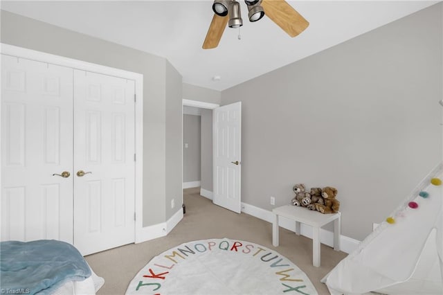 217 Oakmont Park Ct, Kernersville, NC 27284 - bedroom featuring light carpet, ceiling fan, and a closet
