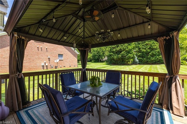 217 Oakmont Park Ct, Kernersville, NC 27284 - wooden terrace featuring outdoor dining area, a ceiling fan, a gazebo, and a lawn