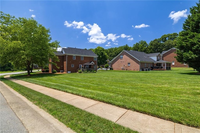 217 Oakmont Park Ct, Kernersville, NC 27284 - view of side of home featuring a lawn and brick siding