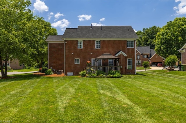 217 Oakmont Park Ct, Kernersville, NC 27284 - back of house featuring a gazebo, a yard, and brick siding