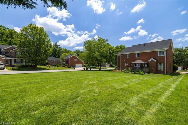 217 Oakmont Park Ct, Kernersville, NC 27284 - view of grassy yard featuring a gazebo, a garage, and concrete driveway
