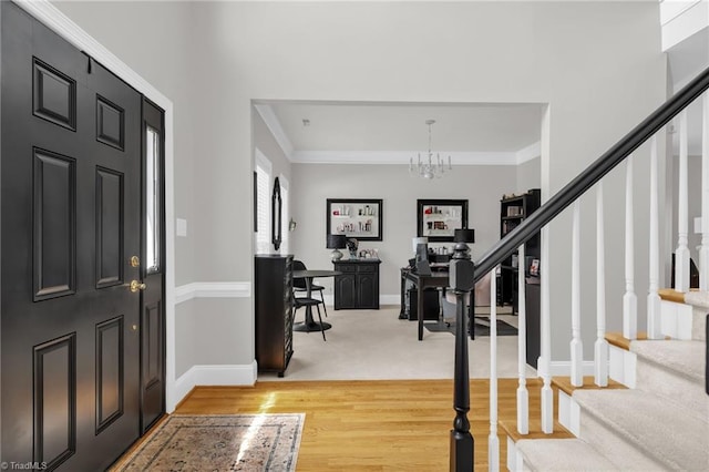 217 Oakmont Park Ct, Kernersville, NC 27284 - entryway with stairs, light wood-type flooring, crown molding, and a chandelier