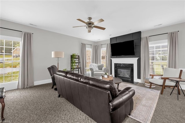 217 Oakmont Park Ct, Kernersville, NC 27284 - living area with carpet, plenty of natural light, a high end fireplace, and ceiling fan