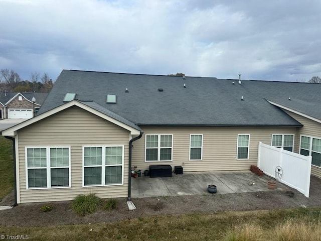 back of property featuring a patio area