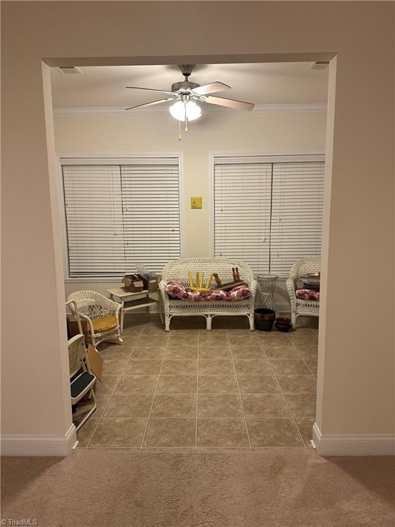 tiled bedroom featuring ceiling fan and ornamental molding