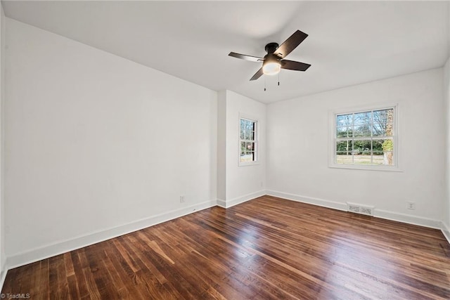 unfurnished room featuring dark hardwood / wood-style floors and ceiling fan