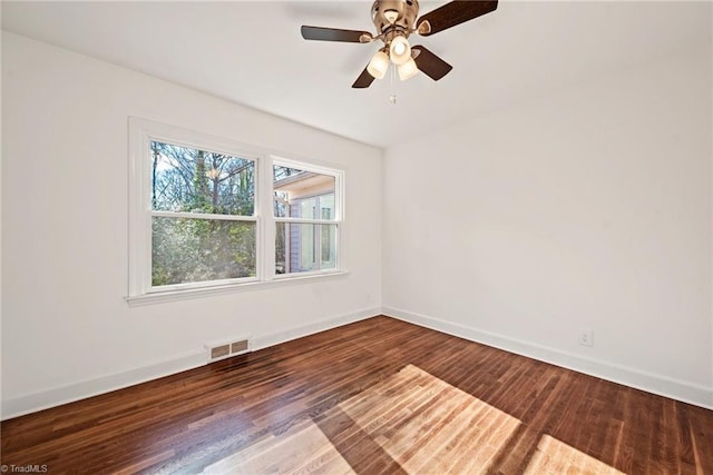 spare room with hardwood / wood-style floors and ceiling fan