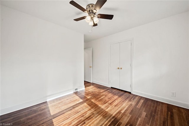 unfurnished room featuring hardwood / wood-style floors and ceiling fan