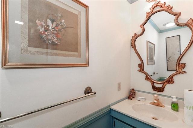 bathroom featuring ornamental molding and vanity