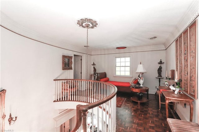 interior space featuring baseboards, ornamental molding, and an upstairs landing