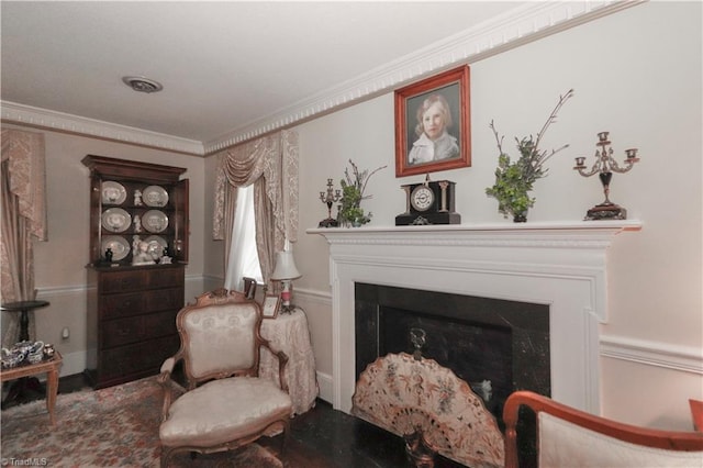 sitting room with ornamental molding