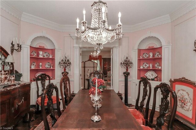 dining space with a chandelier and ornamental molding