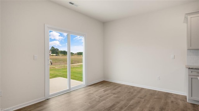 unfurnished dining area with hardwood / wood-style flooring