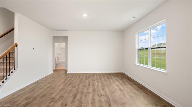 spare room featuring light hardwood / wood-style flooring