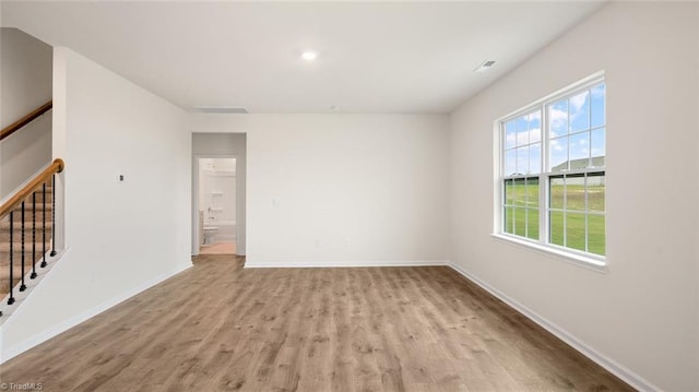 319 Willowbrooke Way, Stokesdale, NC 27357 - spare room with wood finished floors, stairs, and baseboards