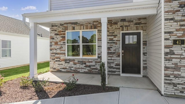 319 Willowbrooke Way, Stokesdale, NC 27357 - property entrance with stone siding and covered porch