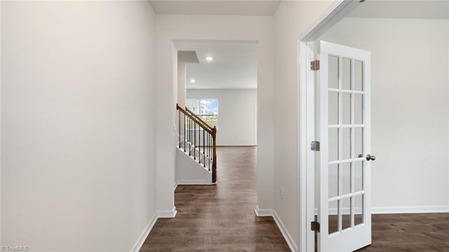 hall with dark hardwood / wood-style floors