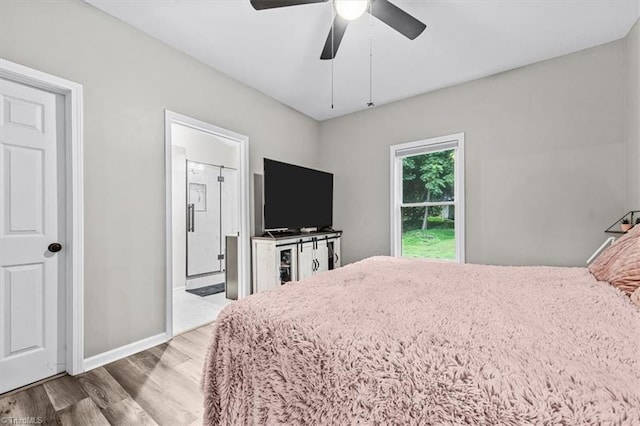 7517 NC Highway 62, Trinity, NC 27370 - bedroom featuring wood finished floors, a ceiling fan, and ensuite bath