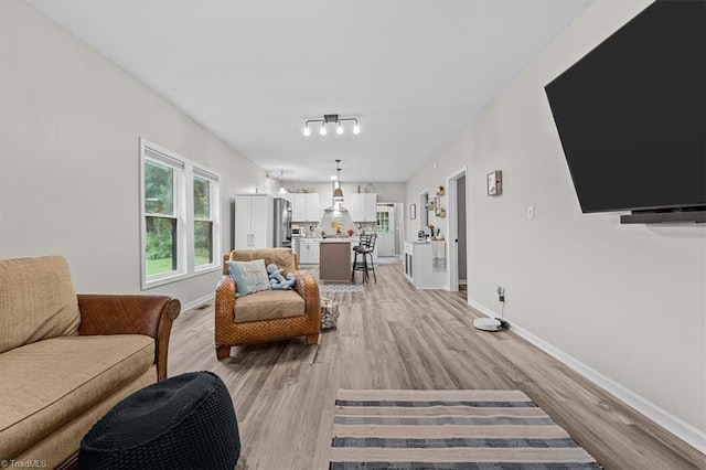 7517 NC Highway 62, Trinity, NC 27370 - living room with light wood-style flooring and baseboards