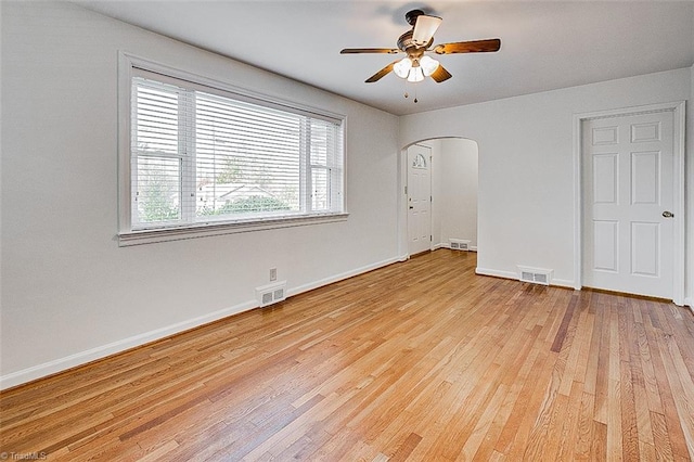 spare room with light hardwood / wood-style flooring and ceiling fan