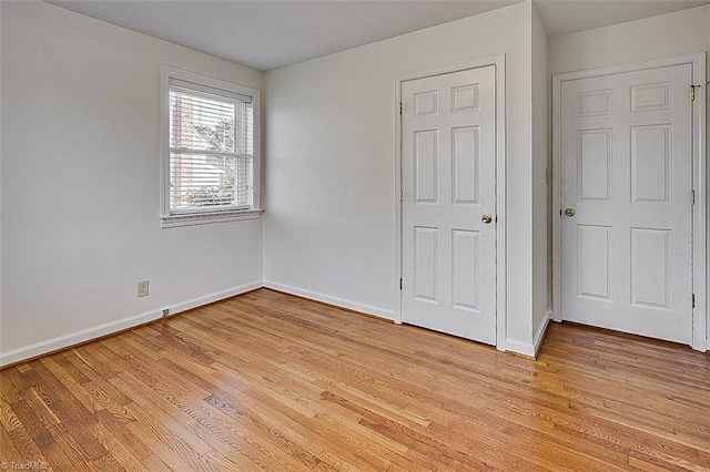 unfurnished bedroom with light hardwood / wood-style flooring