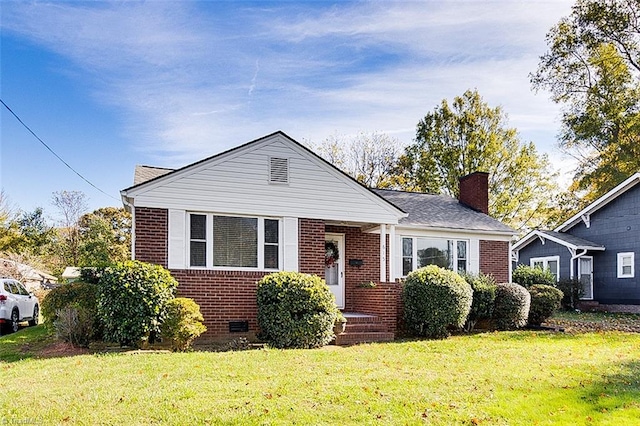 bungalow-style home with a front yard