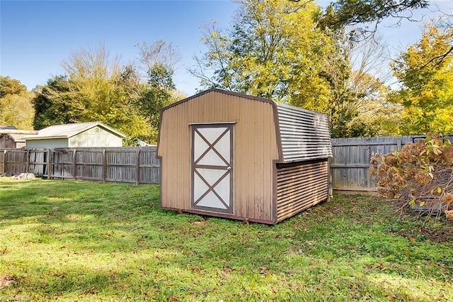 view of outbuilding with a lawn