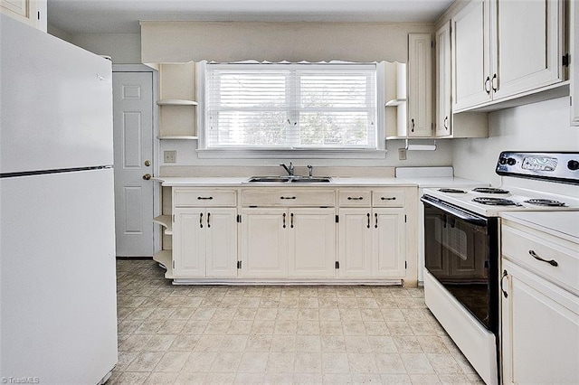 kitchen featuring white cabinetry, sink, and white appliances