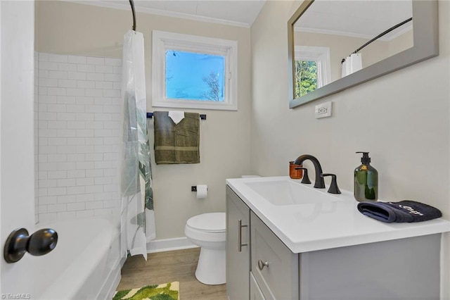 full bathroom featuring toilet, vanity, hardwood / wood-style floors, crown molding, and shower / bath combination with curtain