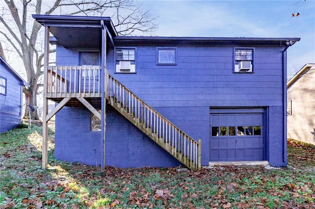 back of property featuring a garage