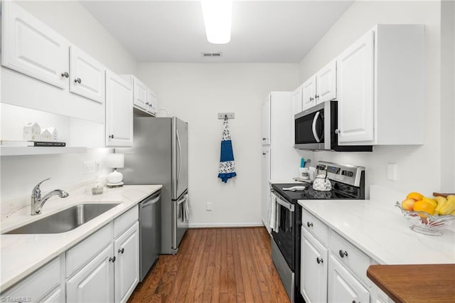 130 W Brick Walk Ct, Mocksville, NC 27028 - kitchen featuring stainless steel appliances, white cabinets, and dark wood-type flooring