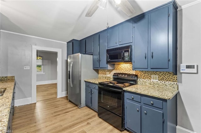 kitchen featuring light stone countertops, black appliances, light hardwood / wood-style flooring, and blue cabinets