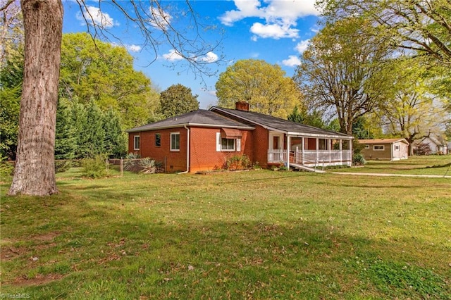 view of side of home featuring a lawn