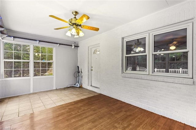 empty room featuring hardwood / wood-style flooring and ceiling fan