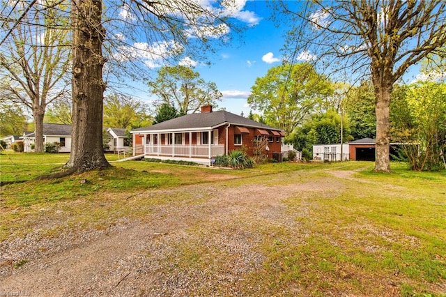 view of yard with a sunroom