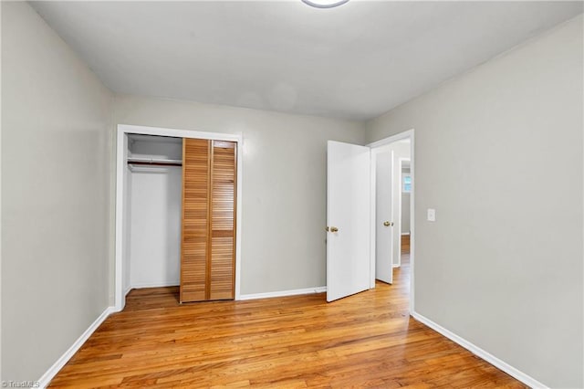 2508 Netherwood Dr, Greensboro, NC 27408 - unfurnished bedroom with light wood-style flooring and a closet