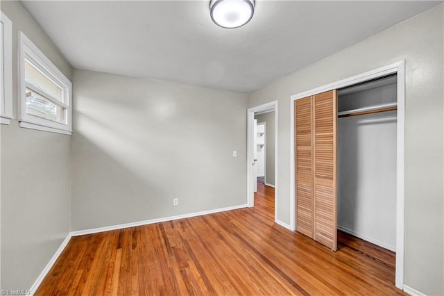 2508 Netherwood Dr, Greensboro, NC 27408 - unfurnished bedroom with wood finished floors and a closet