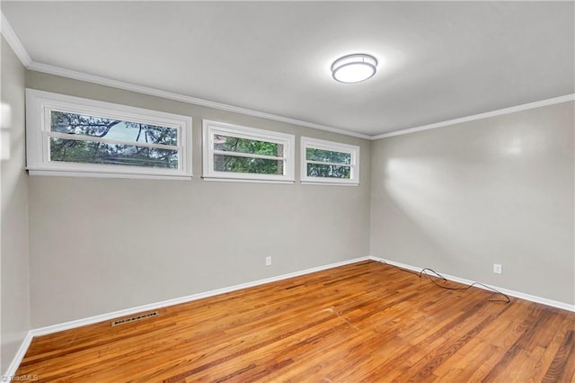 2508 Netherwood Dr, Greensboro, NC 27408 - unfurnished room featuring crown molding and wood finished floors