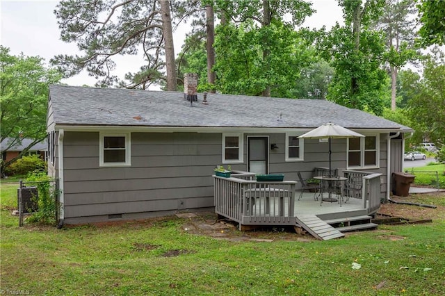 2508 Netherwood Dr, Greensboro, NC 27408 - back of house with a deck, a yard, a chimney, and roof with shingles