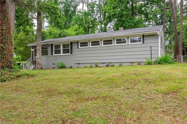 2508 Netherwood Dr, Greensboro, NC 27408 - view of front of home with crawl space, a front lawn, and a chimney