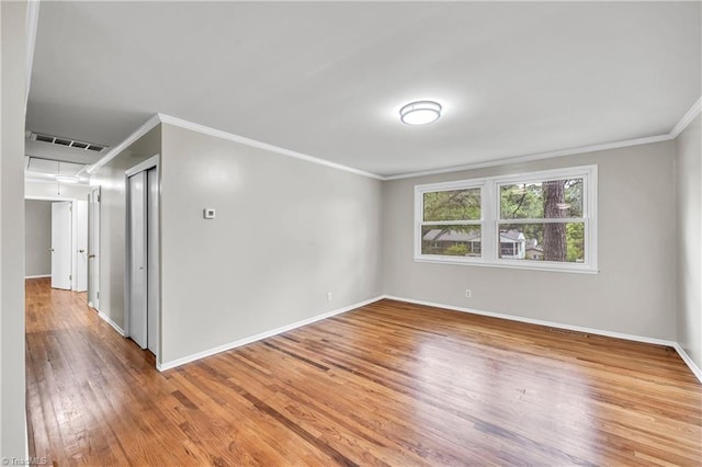 2508 Netherwood Dr, Greensboro, NC 27408 - spare room with ornamental molding and light wood finished floors