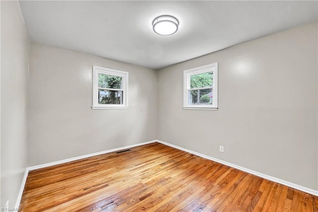2508 Netherwood Dr, Greensboro, NC 27408 - unfurnished room featuring baseboards and light wood finished floors