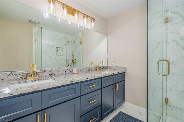 bathroom with a shower with door and vanity