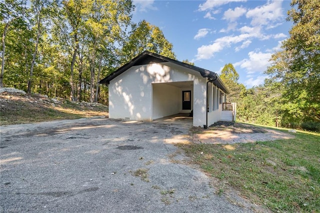 view of home's exterior with a carport