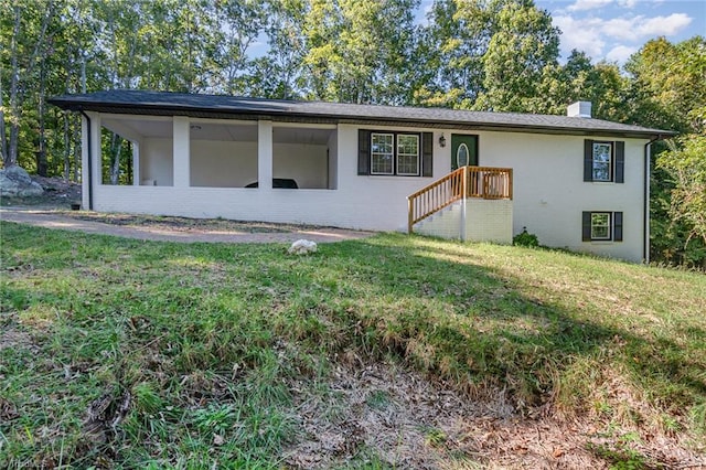 ranch-style house featuring a front lawn