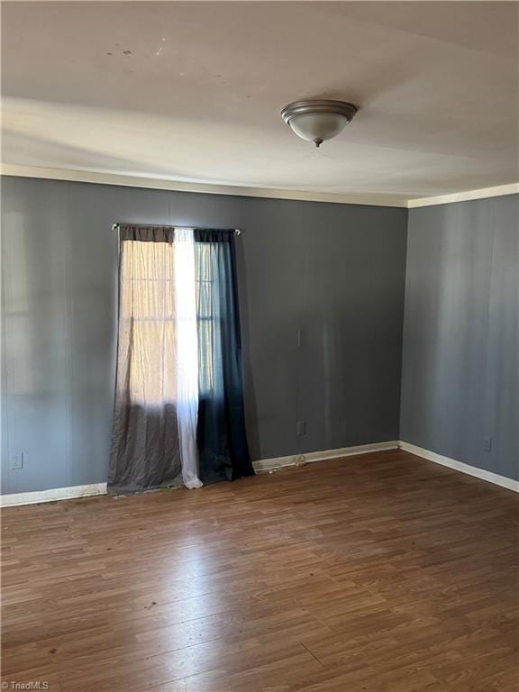 unfurnished room featuring dark hardwood / wood-style flooring